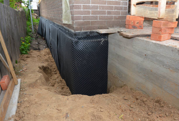 Happy homeowners after waterproofing job in Harrod
